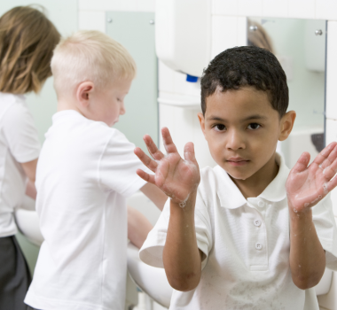 kids washing hands in restroom